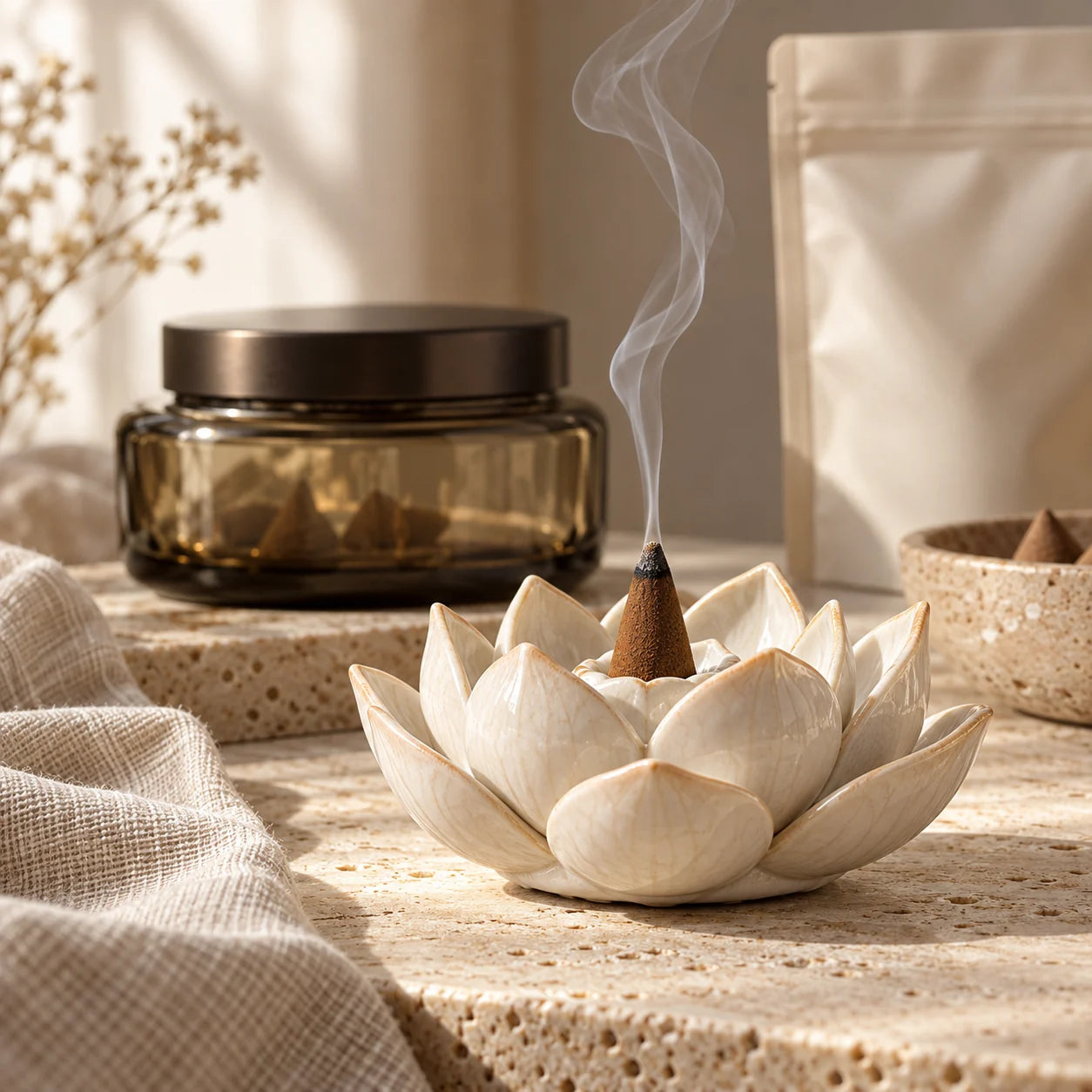 The ceramic lotus holder completes a ritual composition